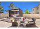 Relaxing backyard patio with an outdoor living area and seating for entertaining at 11072 Pentland Downs St, Las Vegas, NV 89141