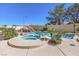 A backyard pool with a waterfall feature and a separate hot tub at 11072 Pentland Downs St, Las Vegas, NV 89141