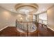 Beautiful winding staircase with dark wood steps and decorative iron railing at 11072 Pentland Downs St, Las Vegas, NV 89141