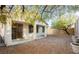 Cozy backyard features a covered patio, low-maintenance landscaping, and privacy fence at 11204 Newbury Hills Ave, Las Vegas, NV 89138