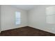 Bedroom features neutral carpet, window with blinds, and a light grey wall color at 11204 Newbury Hills Ave, Las Vegas, NV 89138