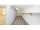 Walk-in closet featuring shelves and a gray carpeted floor at 11204 Newbury Hills Ave, Las Vegas, NV 89138