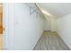Compact walk-in closet featuring shelves and a gray carpeted floor at 11204 Newbury Hills Ave, Las Vegas, NV 89138