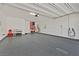 Spacious garage with epoxy flooring, ample storage, and an electric vehicle charging outlet at 11705 Bearpaw Meadow Ave, Las Vegas, NV 89138