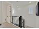 Bright hallway with modern railing and contemporary design elements at 11705 Bearpaw Meadow Ave, Las Vegas, NV 89138