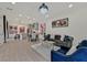 Open-concept living room and dining area with modern decor, stylish furniture, and contemporary art at 11705 Bearpaw Meadow Ave, Las Vegas, NV 89138