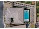 Overhead view of property showcasing roof, rectangular pool, and landscaped backyard with surrounding neighborhood at 12346 Valley Chase Ave, Las Vegas, NV 89138