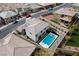 Aerial view showcases backyard's sparkling pool, jacuzzi, artificial turf, and landscaped perimeters at 12346 Valley Chase Ave, Las Vegas, NV 89138