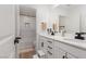 Bright bathroom with dual sinks, modern fixtures, and a view of the tub and shower area at 12346 Valley Chase Ave, Las Vegas, NV 89138