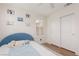 Bright bedroom featuring a blue bed, plush carpeting and bright natural light from the window at 12346 Valley Chase Ave, Las Vegas, NV 89138
