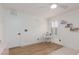 Bright bedroom featuring a small desk with a chair, natural light, and wood look floors at 12346 Valley Chase Ave, Las Vegas, NV 89138