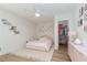 Cozy bedroom with a pink bed, decor, and walk-in closet perfect for a room at 12346 Valley Chase Ave, Las Vegas, NV 89138