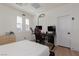 Well-lit bedroom features a modern desk setup and comfortable gaming chair at 12346 Valley Chase Ave, Las Vegas, NV 89138