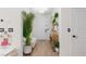 Inviting entryway with light wood floors, bright white walls, and stylish decor at 12346 Valley Chase Ave, Las Vegas, NV 89138