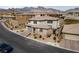 Aerial view of a modern two-story home with desert landscaping and a two-car garage at 12346 Valley Chase Ave, Las Vegas, NV 89138