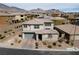 Aerial view of a modern two-story home with desert landscaping at 12346 Valley Chase Ave, Las Vegas, NV 89138