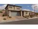 Charming two-story home with a two-car garage and manicured front yard at 12346 Valley Chase Ave, Las Vegas, NV 89138