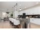 Spacious kitchen featuring a large island, pendant lighting, and modern white cabinetry at 12346 Valley Chase Ave, Las Vegas, NV 89138