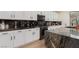 Well-equipped kitchen with modern appliances, granite countertops, and ample cabinet space at 12346 Valley Chase Ave, Las Vegas, NV 89138
