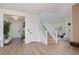 Bright, open living area with hardwood floors and stairway access at 12346 Valley Chase Ave, Las Vegas, NV 89138