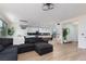 Open-concept living area connecting to the kitchen with modern lighting and decor at 12346 Valley Chase Ave, Las Vegas, NV 89138