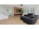 Spacious living room with wood-look flooring, modern decor, and lots of natural light at 12346 Valley Chase Ave, Las Vegas, NV 89138