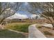 Scenic park view with a walking path, green spaces, and mature trees at 12346 Valley Chase Ave, Las Vegas, NV 89138