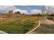 Community park with grassy areas and seating, ideal for relaxation and recreation at 12346 Valley Chase Ave, Las Vegas, NV 89138