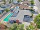 Aerial view of home featuring pool, covered patio, solar panels at 1589 Silver Mesa Way, Las Vegas, NV 89169