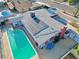 Stunning aerial view of a home showcasing a large private pool, patio area, solar panels, and well-maintained landscaping at 1589 Silver Mesa Way, Las Vegas, NV 89169
