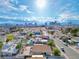 City view of a home with a pool, showcasing its neighborhood setting with views of the city skyline in the distance at 1589 Silver Mesa Way, Las Vegas, NV 89169