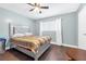 Bedroom featuring plush headboard and neutral tones at 1589 Silver Mesa Way, Las Vegas, NV 89169