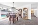 Bright dining room overlooking the pool, featuring hardwood floors at 1589 Silver Mesa Way, Las Vegas, NV 89169