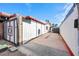 Side view of a single-story home with a gated area and a walkway leading to the backyard at 1589 Silver Mesa Way, Las Vegas, NV 89169