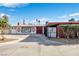 Single-story home featuring unique architectural details and a well-maintained front yard with mature shrubbery at 1589 Silver Mesa Way, Las Vegas, NV 89169
