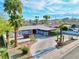Charming single-story home with a circular driveway, desert landscaping, and mature palm trees at 1589 Silver Mesa Way, Las Vegas, NV 89169