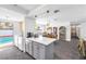 Bright open kitchen with island and pool view at 1589 Silver Mesa Way, Las Vegas, NV 89169