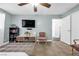 Cozy living room with neutral walls, tile flooring, and a stylish chair at 1589 Silver Mesa Way, Las Vegas, NV 89169