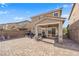 Paver backyard, perfect for entertaining, with a covered patio and BBQ area at 1606 Wild Grain Ave, North Las Vegas, NV 89086