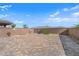 Large backyard with pavers, landscaping, and a swing set at 1606 Wild Grain Ave, North Las Vegas, NV 89086