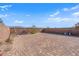Spacious backyard featuring pavers, a swing set, and mature landscaping at 1606 Wild Grain Ave, North Las Vegas, NV 89086