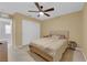 Cozy bedroom featuring a ceiling fan and neutral tones, creating a comfortable and inviting space at 1606 Wild Grain Ave, North Las Vegas, NV 89086