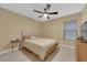 Comfortable bedroom featuring a ceiling fan and neutral tones, creating a relaxing atmosphere at 1606 Wild Grain Ave, North Las Vegas, NV 89086
