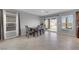 Bright dining area with tile floors, neutral colors, modern furnishings and access to the backyard at 1606 Wild Grain Ave, North Las Vegas, NV 89086