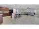 Open-concept kitchen with a large island, pendant lighting, and stainless steel appliances at 1606 Wild Grain Ave, North Las Vegas, NV 89086