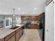 Modern kitchen featuring stainless steel appliances, granite countertops, and a view to the backyard at 1606 Wild Grain Ave, North Las Vegas, NV 89086