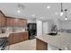 Modern kitchen featuring granite counters, a center island with seating, and stainless steel appliances at 1606 Wild Grain Ave, North Las Vegas, NV 89086