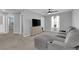 Upstairs living room with sectional sofa, TV, and plenty of natural light at 1606 Wild Grain Ave, North Las Vegas, NV 89086