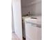 Laundry area equipped with a stacked washer and dryer, plus shelf at 1655 Morse Arberry Ave, Las Vegas, NV 89106