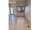Tastefully designed living room with tiled floors and modern window at 1655 Morse Arberry Ave, Las Vegas, NV 89106